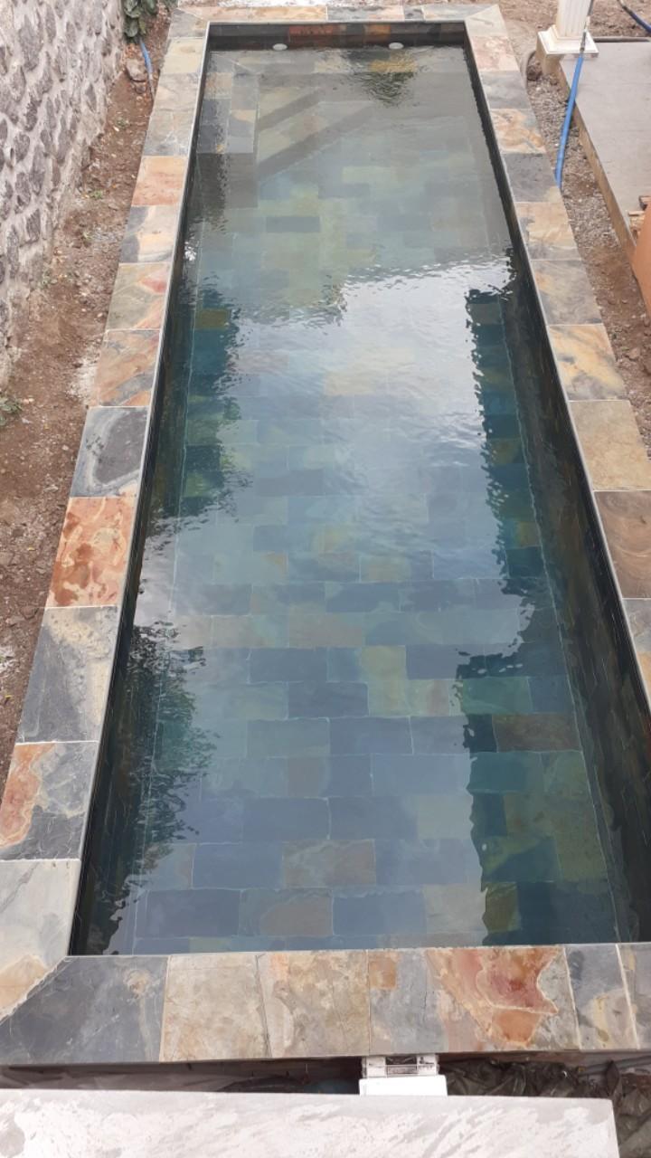 Construction de piscine en pierre naturelle L'Étang-Salé